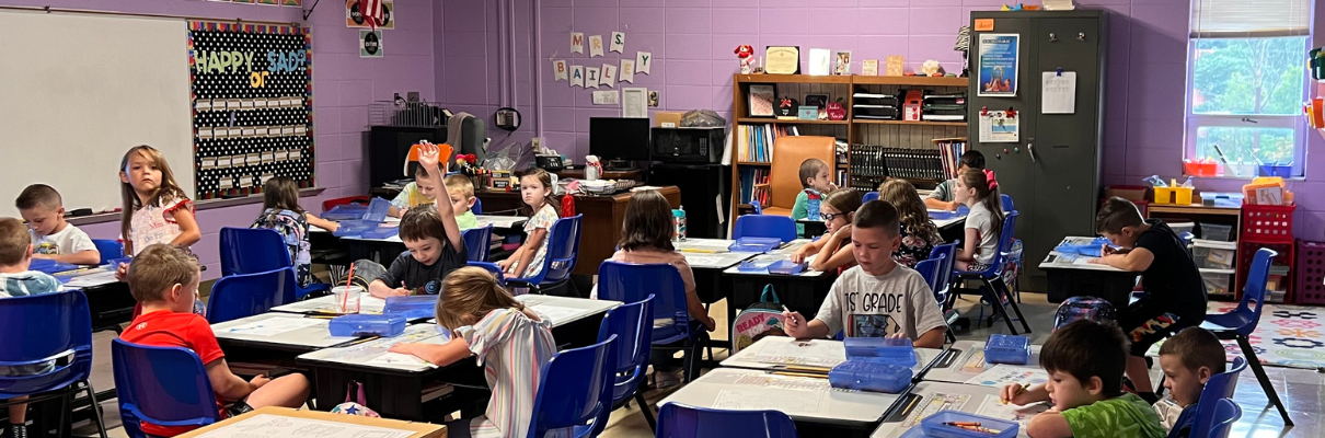 Classroom of students at Flat Lick Elementary engaged in a learning lesson at their desk.
